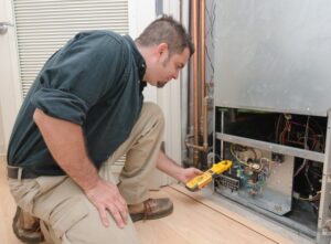 A technician conducting an HVAC tune-up in Murfreesboro